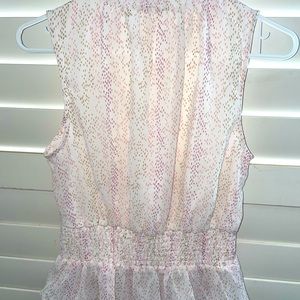 Peplum Top Sleeveless with flattering neckline